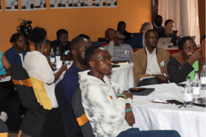 Young media creators collaborating on a flipchart during a Center for Media Innovation Hub workshop session