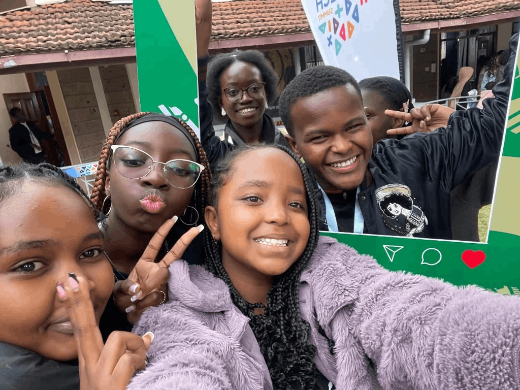 Children using a phone to take a selfie during the Learners EdTech Summit 2025 at Milele Hotel on August 27, 2025.