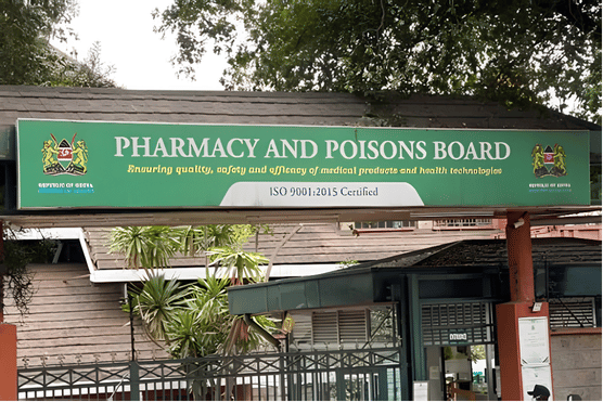 Exterior entrance sign of the Pharmacy and Poisons Board headquarters showing the Kenya coat of arms and official logo that announced eye injection alert.