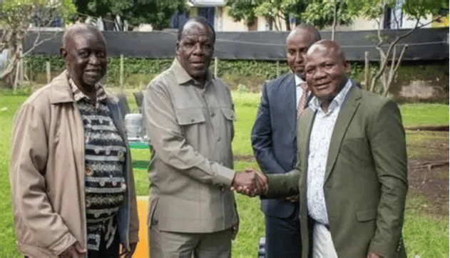 Cooperatives and MSMEs Development Cabinet Secretary Wycliffe Oparanya (second left) shakes hands with Kakamega Governor Fernandes Barasa (far right) during an ODM leadership reconciliation meeting chaired by party leader Dr. Oburu Oginga (far left). Also present is Suna East MP and ODM Director of Elections Junet Mohamed (background).