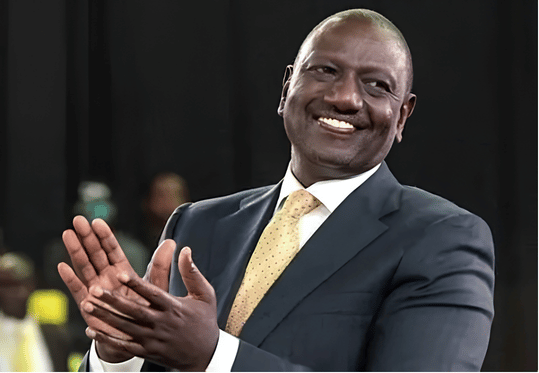 President William Ruto smiling and clapping at a public political event ahead of the 2027 Election