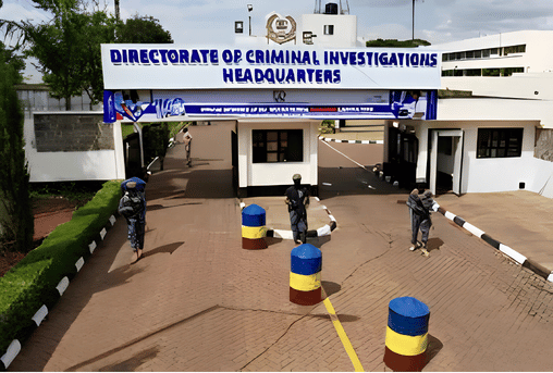 Main entrance gate of the Directorate of Criminal Investigations (DCI) Headquarters in Nairobi featuring security barriers and official signage.