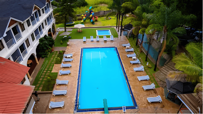 High-angle aerial view of the Bantu Resort swimming pool, one of 18 properties seized from the former lands registrar and his family.