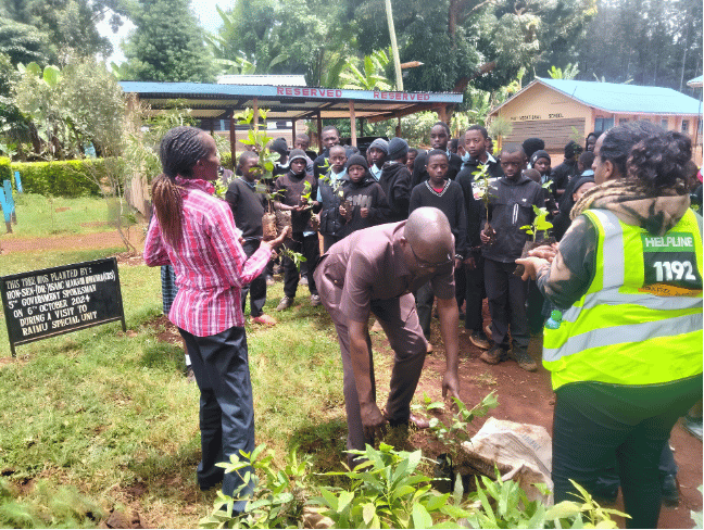 NACADA team and Kirinyaga pupils gathering with tree seedlings during climate drive