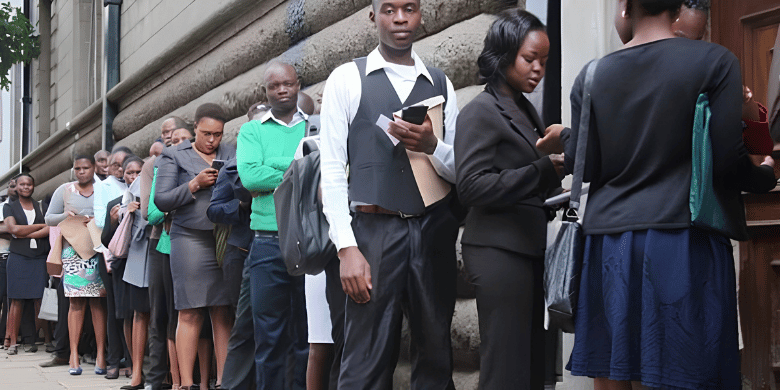 A long queue of job seekers holding academic documents awaiting interviews for ipoa jobs.