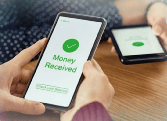 Person holding a smartphone displaying a successful mobile money transaction secured by Safaricom from cyber attack breaches.