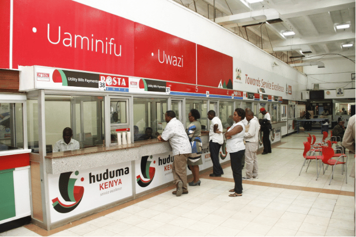 Citizens waiting in line at a Huduma Centre service counter to access government services before USSD codes streamlined registration
