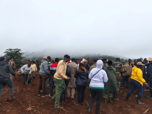 Nyeri residents and local officials gathering on cleared forest land to plant tree seedlings on Mazingira Day